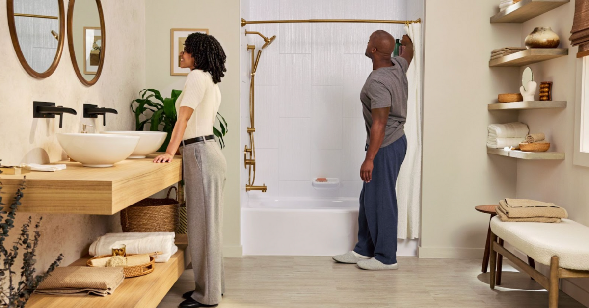 A couple admiring their newly remodeled bathroom.